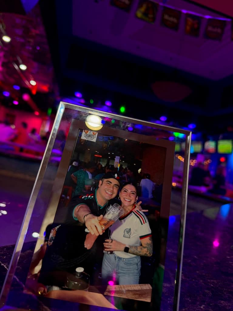 Silver frame — couple at neon bar