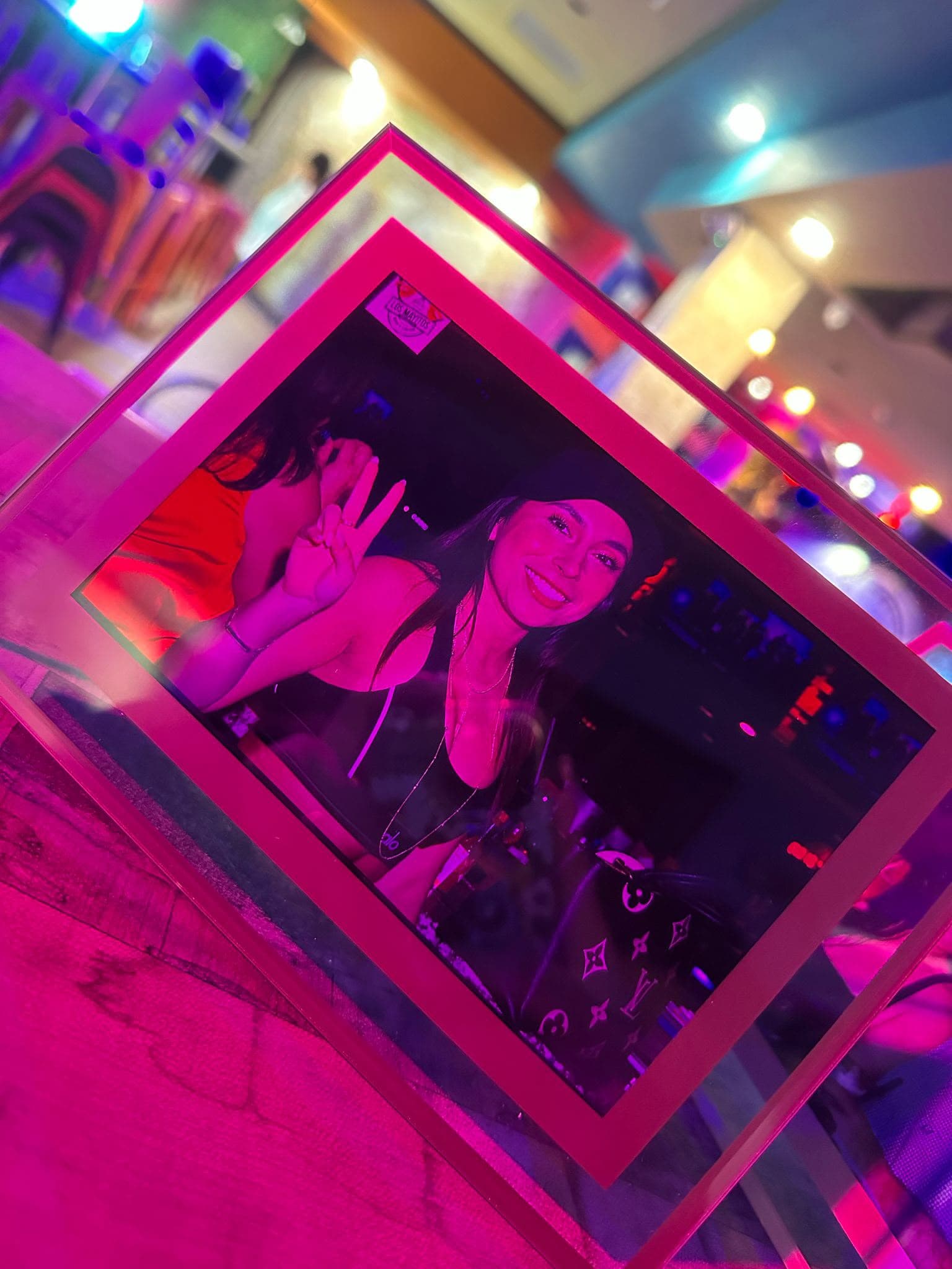 Acrylic frame with pink neon at nightclub